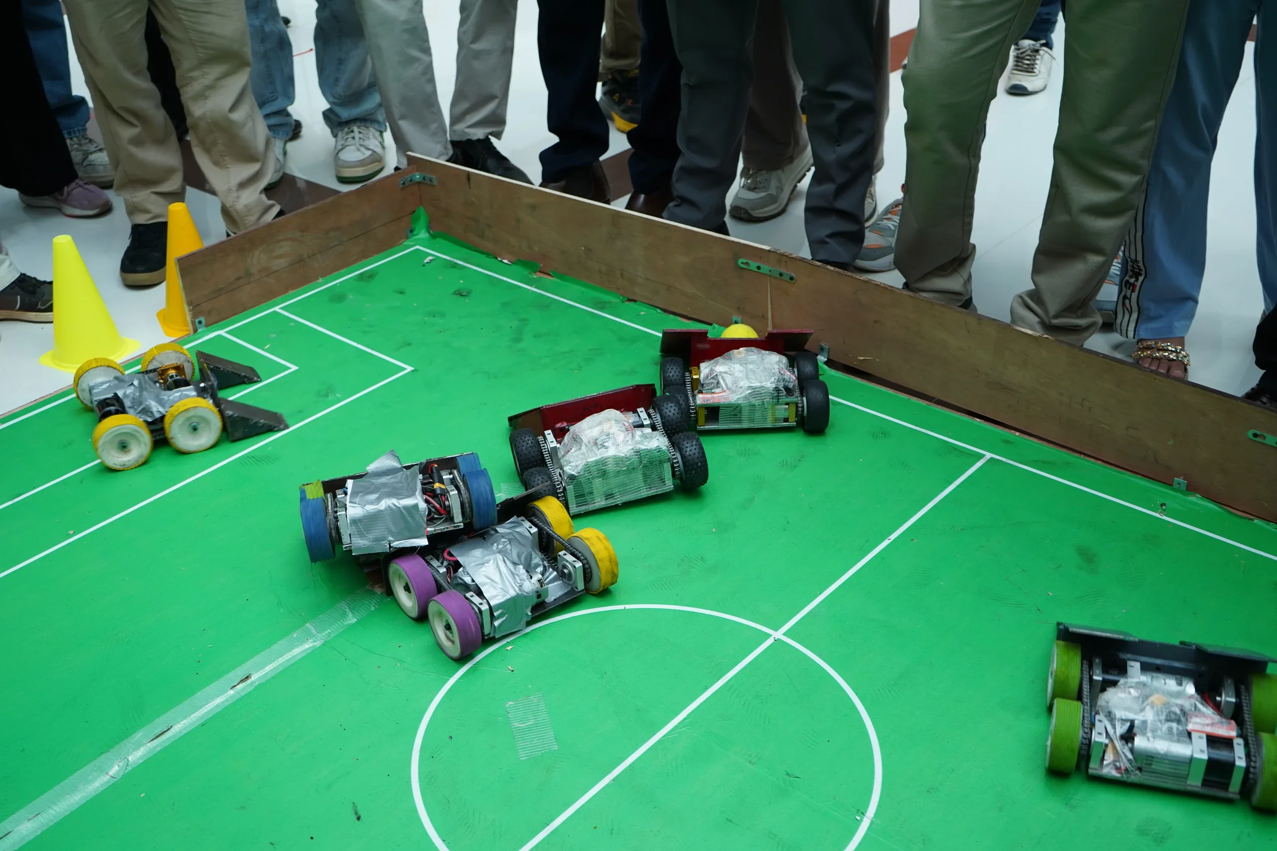 Soccer robots with metal ball guides in close competition at RGI 2026