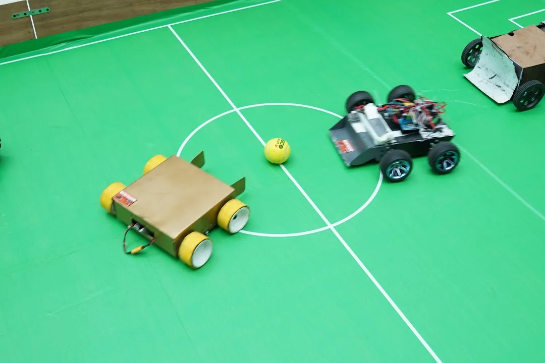 Junior soccer robots approaching the ball at RGI 2026
