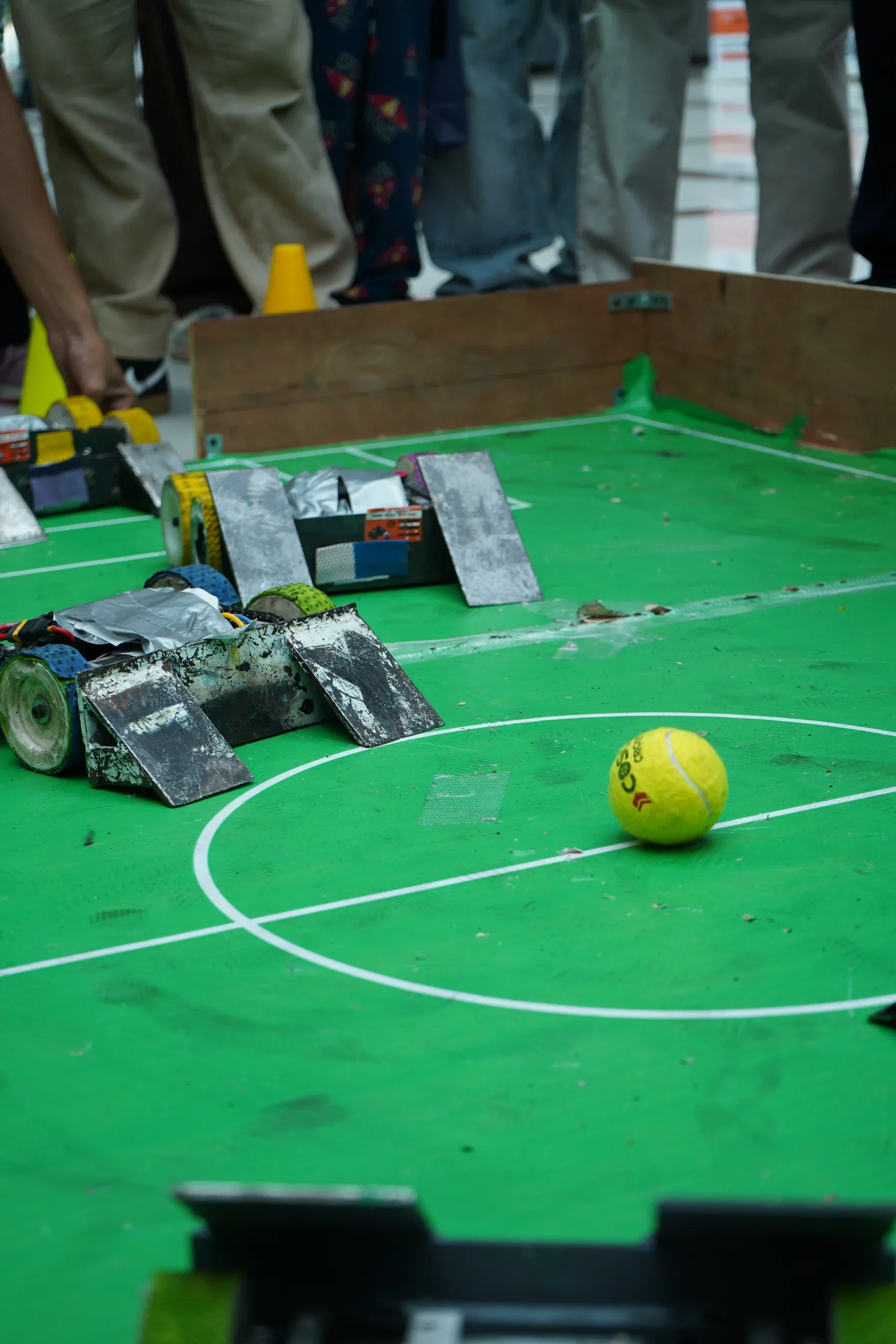 Pitch-level view of the football and student-built robots at RGI 2026