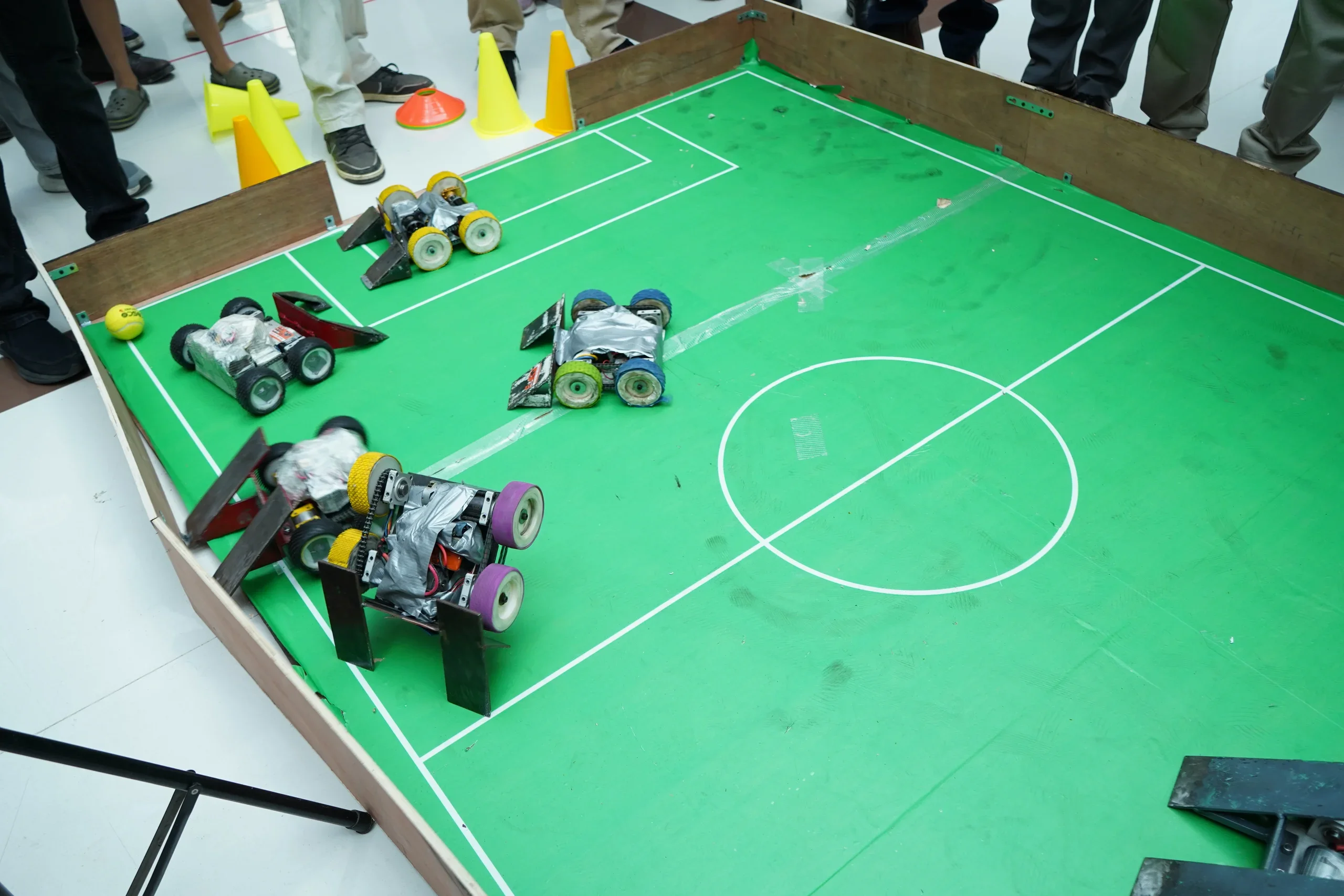 Wide view of the RGI soccer arena during a multi-robot match