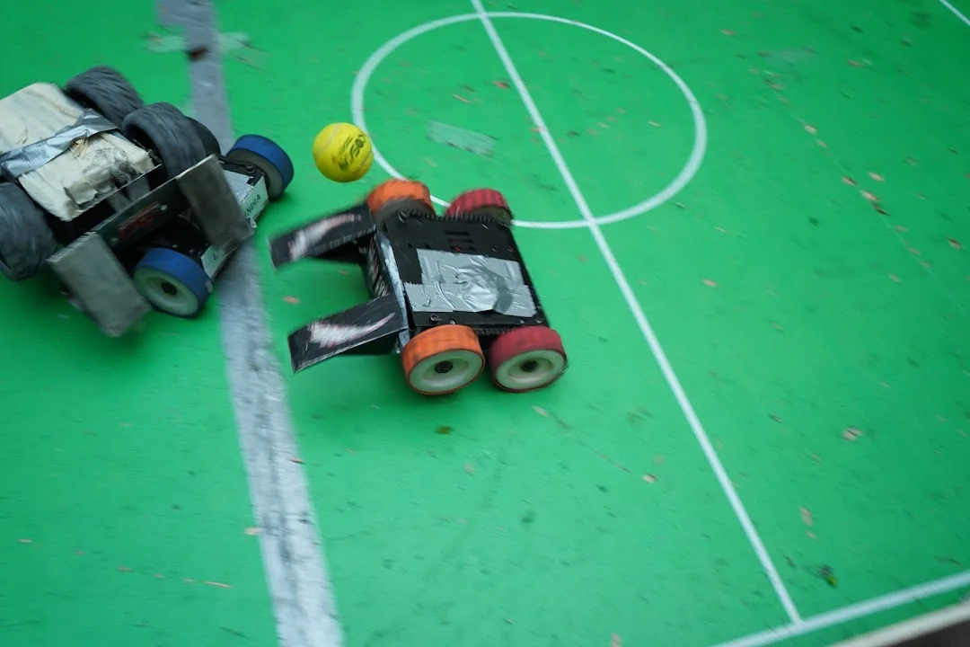 Soccer robots contesting the ball at RGI 2026