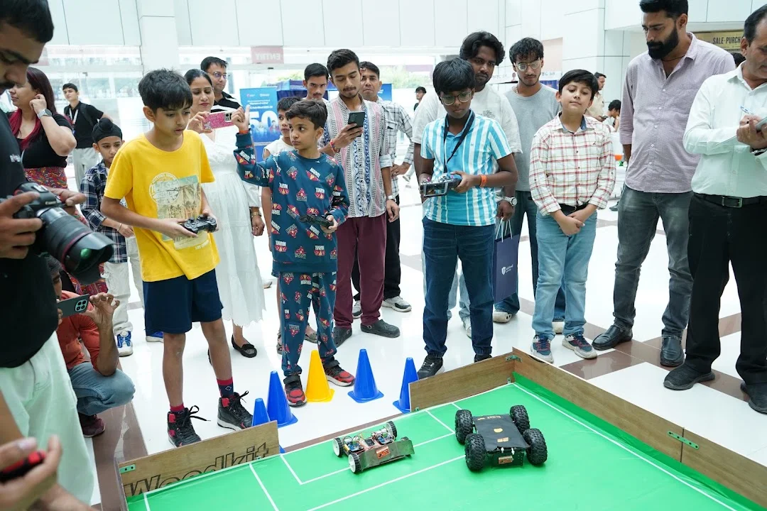 Junior participants controlling their robots at Robo Goal India 2026